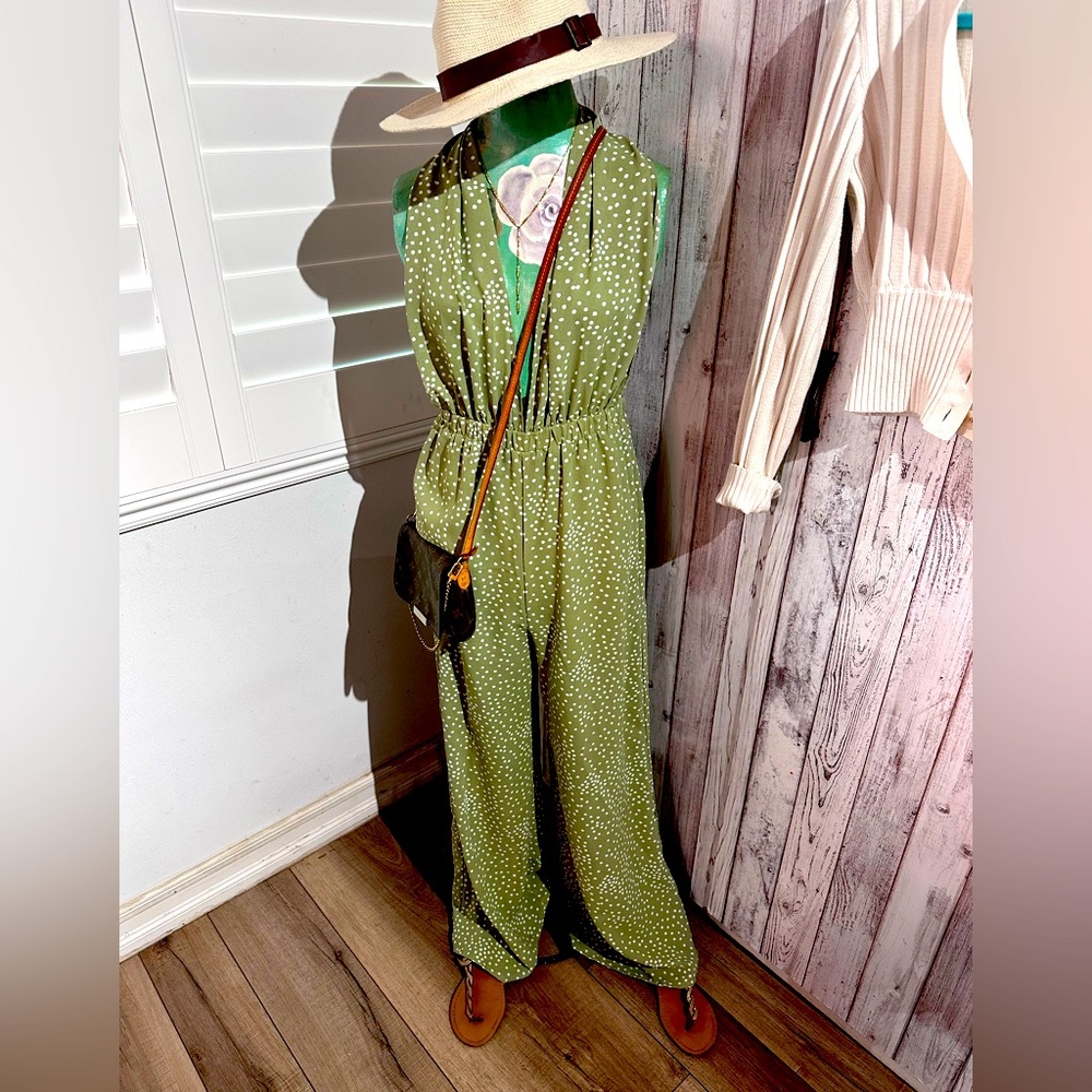 One piece halter/tie neck, low back, wide leg pant suit, size medium